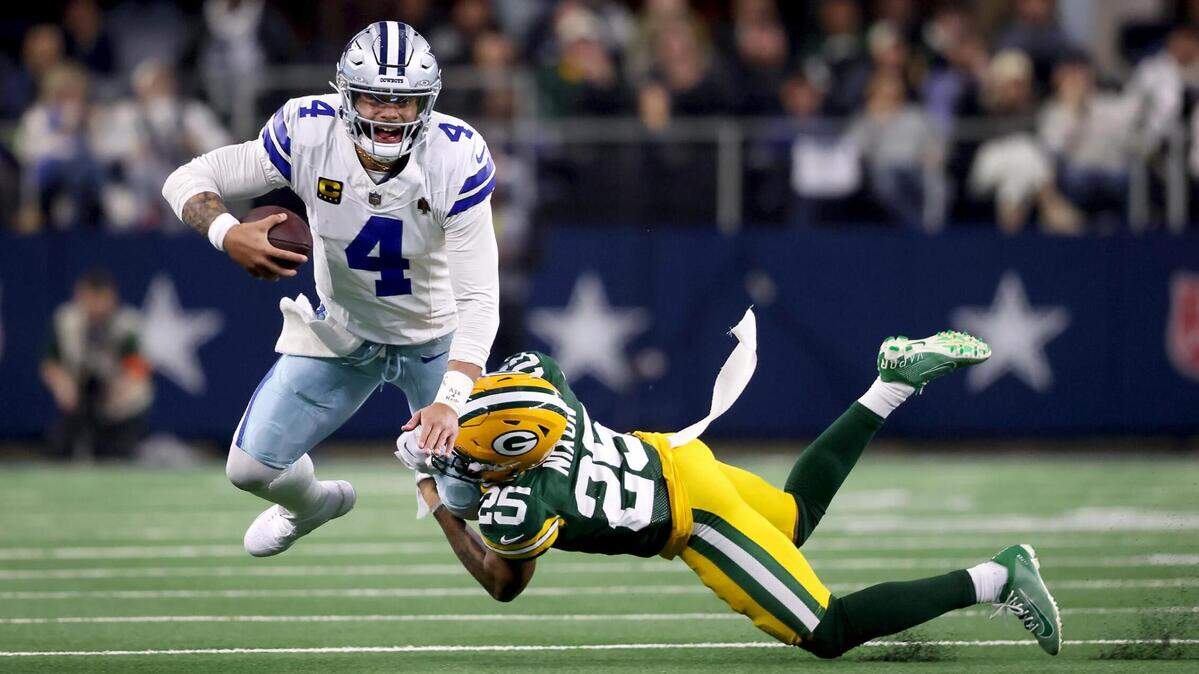 Dallas Cowboys quarterback Dak Prescott is sacked by Green Bay Packers cornerback Keisean Nixon during the second quarter of the NFC wild-card playoff game on Sunday, January 14, 2024, at AT&T Stadium in Arlington.