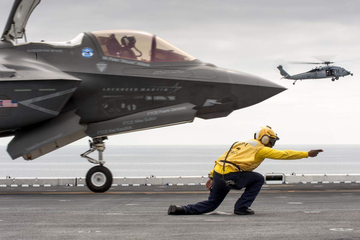 BF-1 flight #330, piloted by Lt. Col. C.R. Clift, and BF-5 flight #89, piloted by Capt. Michael Kingen, perform STOVL operations aboard the USS WASP DT-II.