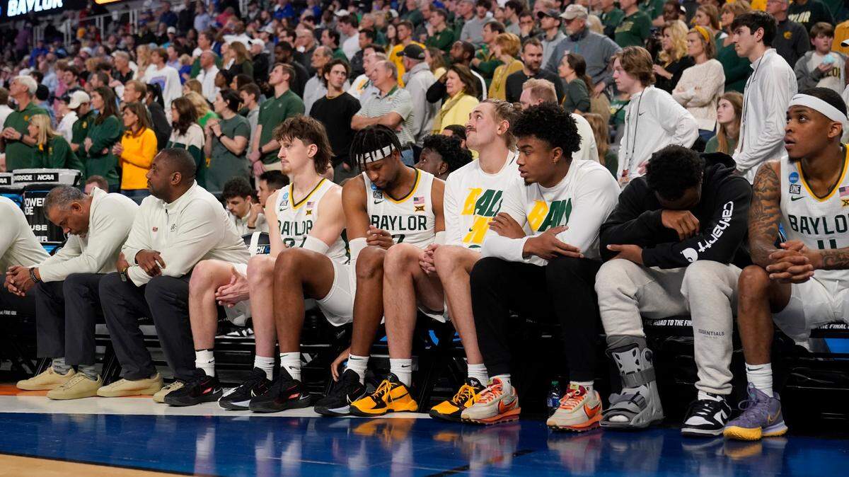 The Baylor bench watches the final seconds of an overtime loss to North Carolina in the second round of the NCAA Tournament Saturday at Dickies Arena in Fort Worth.