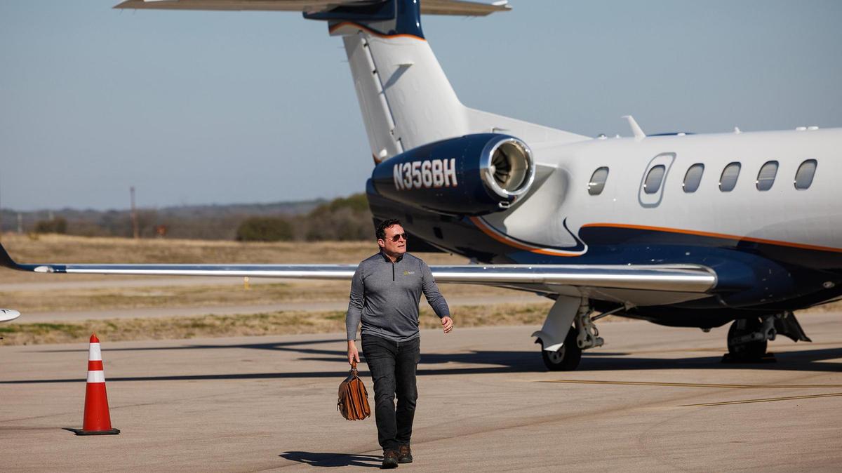 Pilot Brian Black of Little Rock, Arkansas, walks toward the Granbury Regional Airport Terminal after landing his Cirrus SR20 in February. Black is an architect working on a project for Nissan in Granbury.
