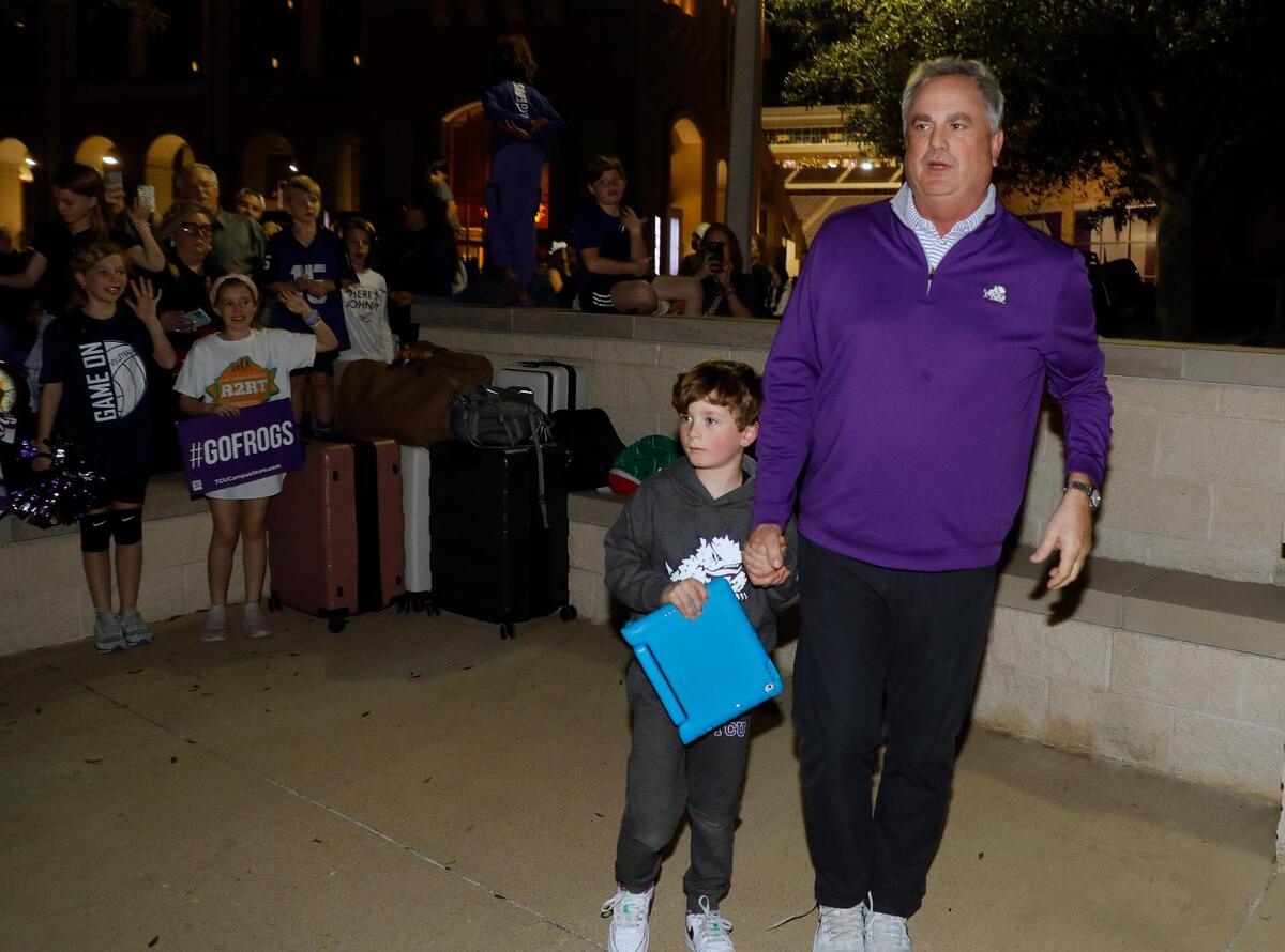 TCU head coach Sonny Dykes stops to talk to fans and have photos made with them after returning home from the CFP national championship football game to the TCU Campus in Fort Worth, Texas, Tuesday, Jan. 10, 2023.