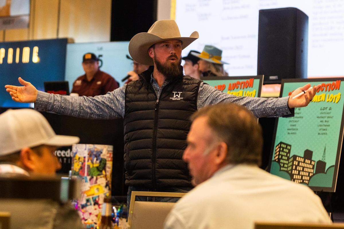 Seth Hale working as a bid spotter during the Deer Breeding Corp.’s January 2022 auction at Horseshoe Bay Resort.