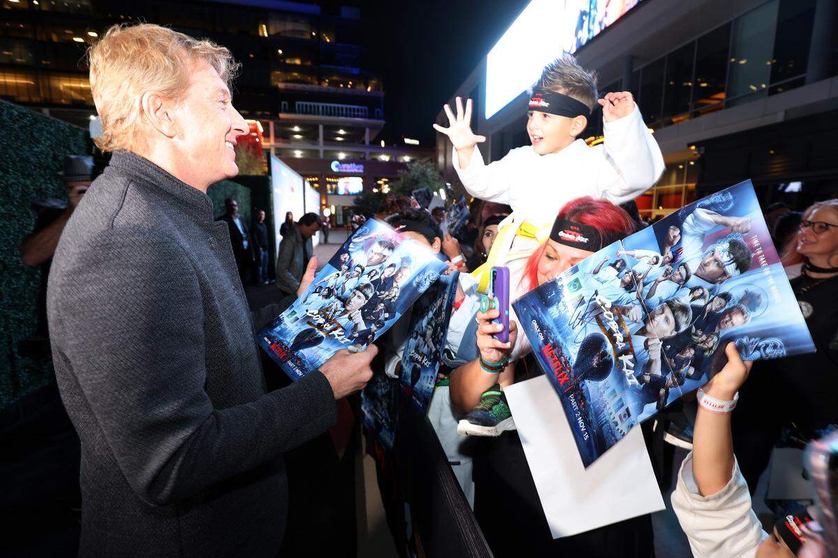 IRVING, TEXAS - NOVEMBER 13: William Zabka signs autographs for fans at the COBRA KAI Dallas Red Carpet Fan Screening at Alamo Drafthouse Cinema Las Colinas on November 13, 2024 in Irving, Texas.