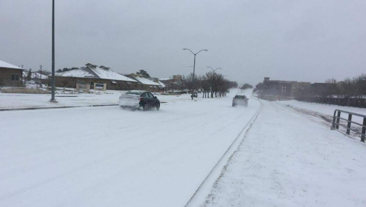 Mid-Cities Boulevard in North Richland Hills was open Thursday morning. Many roads and highways in North Texas were open but hazardous after a winter storm dumped ice and snow.