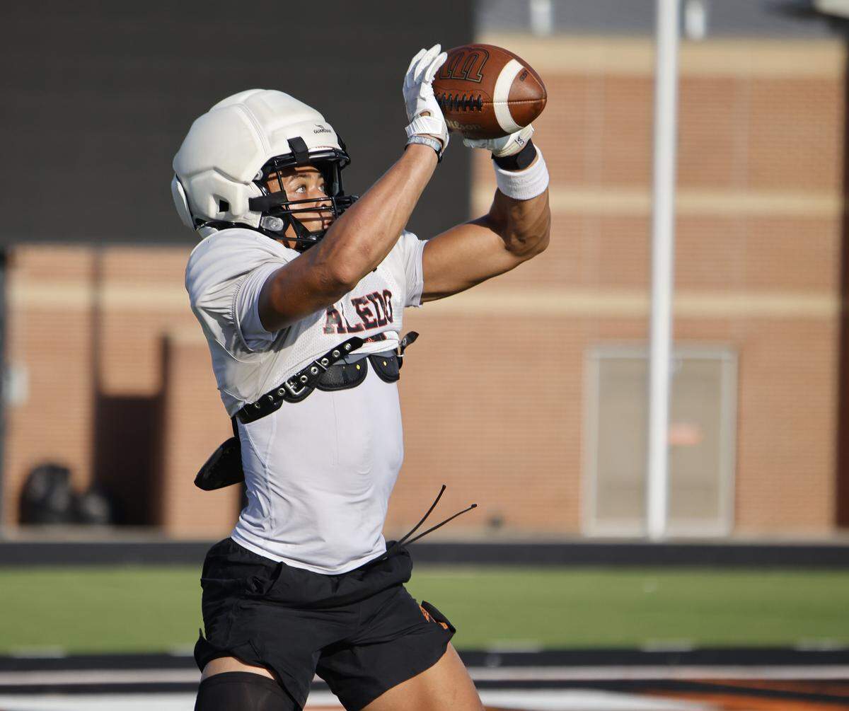 Wide receiver Kaydon Finley catches a pass during Aledo High School's morning practice at Tim Buchanan Stadium in Aledo, Texas, Monday August, 18, 2025.