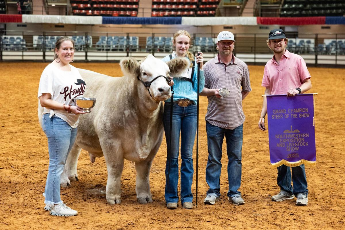 La Vernia resident Mattison Koepp, 16, takes a photo with her family after her steer won Grand Champion Steer of the Show at the Fort Worth Stock Show & Rodeo on Friday, Feb. 7, 2025. Koepp took home the Reserve champion award in last year’s event.