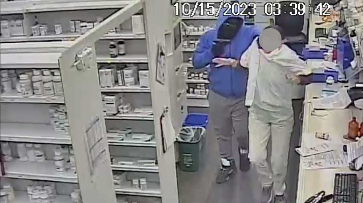 Two armed men robbing employees of a Lake Worth Walgreens early Sunday were captured on surveillance video.