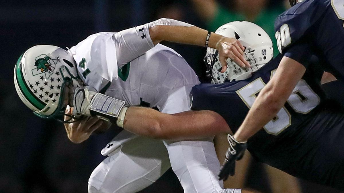 Southlake Carroll quarterback Will Bowers, left, in action earlier this season, completed 22 of 30 passes for 290 yards and two touchdowns in the Dragons’ 45-0 victory over Haslet Eaton on Friday.