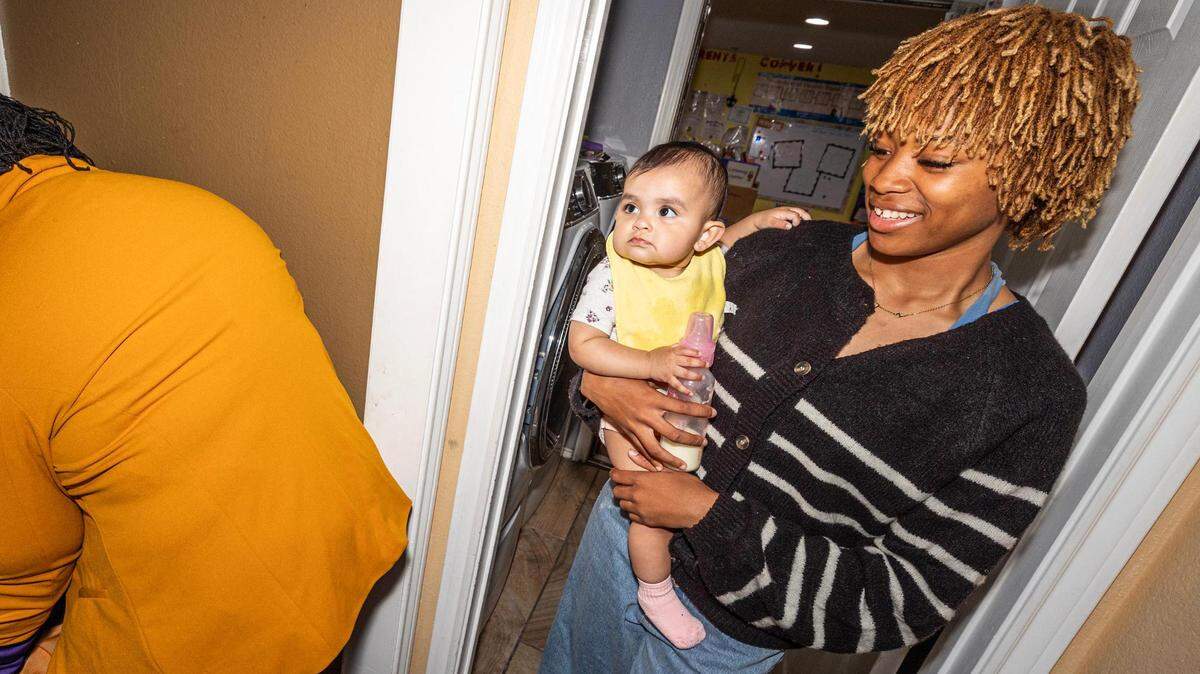 Teacher Halle Chaney carries her infant student Natalia Arriago to the infant sleeping area in the evening at the Future Scholars’ Childcare and Transportation child care home in Grand Prairie on March 14, 2024. Future Scholar’s is one of few centers in Tarrant County that provide 24/7 child care.