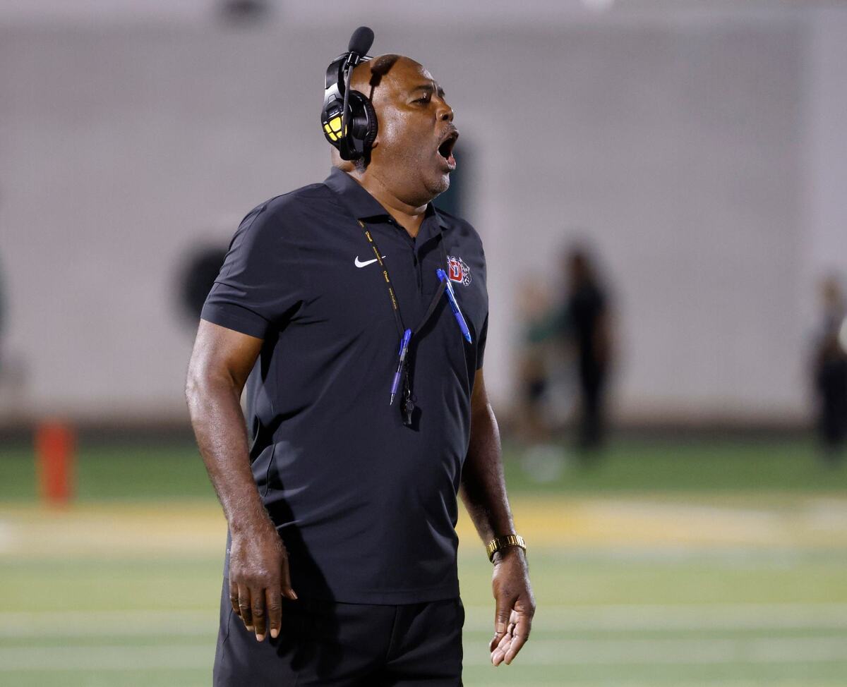 Duncanville head coach Reginald Samples yells in to the team during a time out during a District 11-6A football game at Eagle Stadium in DeSoto, Texas, Friday, Oct. 11, 2024.