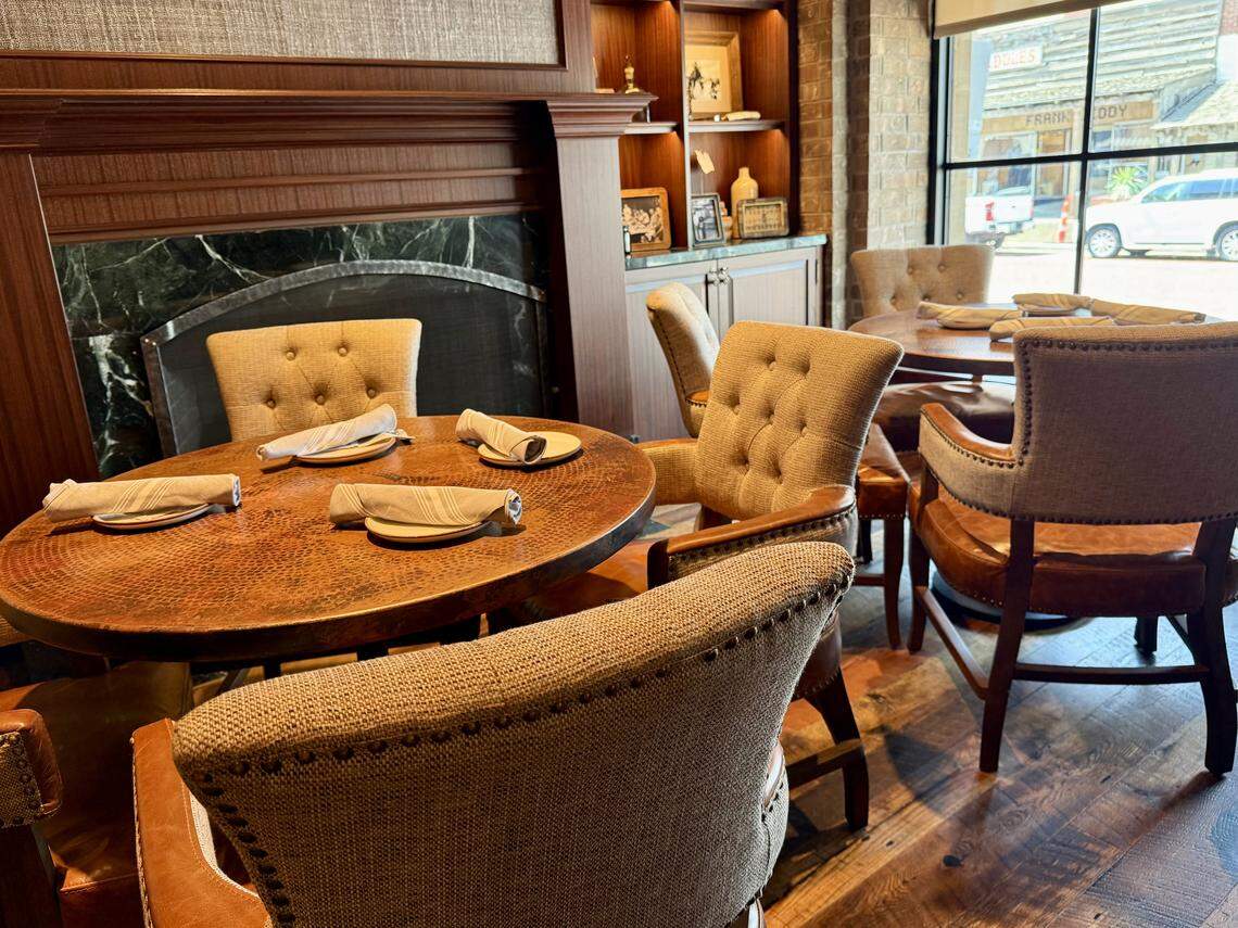 Dining tables by a front window in the bar at Cattlemen’s Steak House., Sept. 16, 2025.