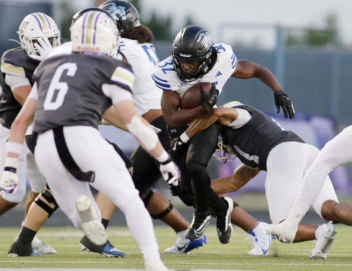 Trophy Club’s Sean Robinson breaks a tackle during a UIL football game at Keller ISD Stadium on Thursday, October 3, 2024.