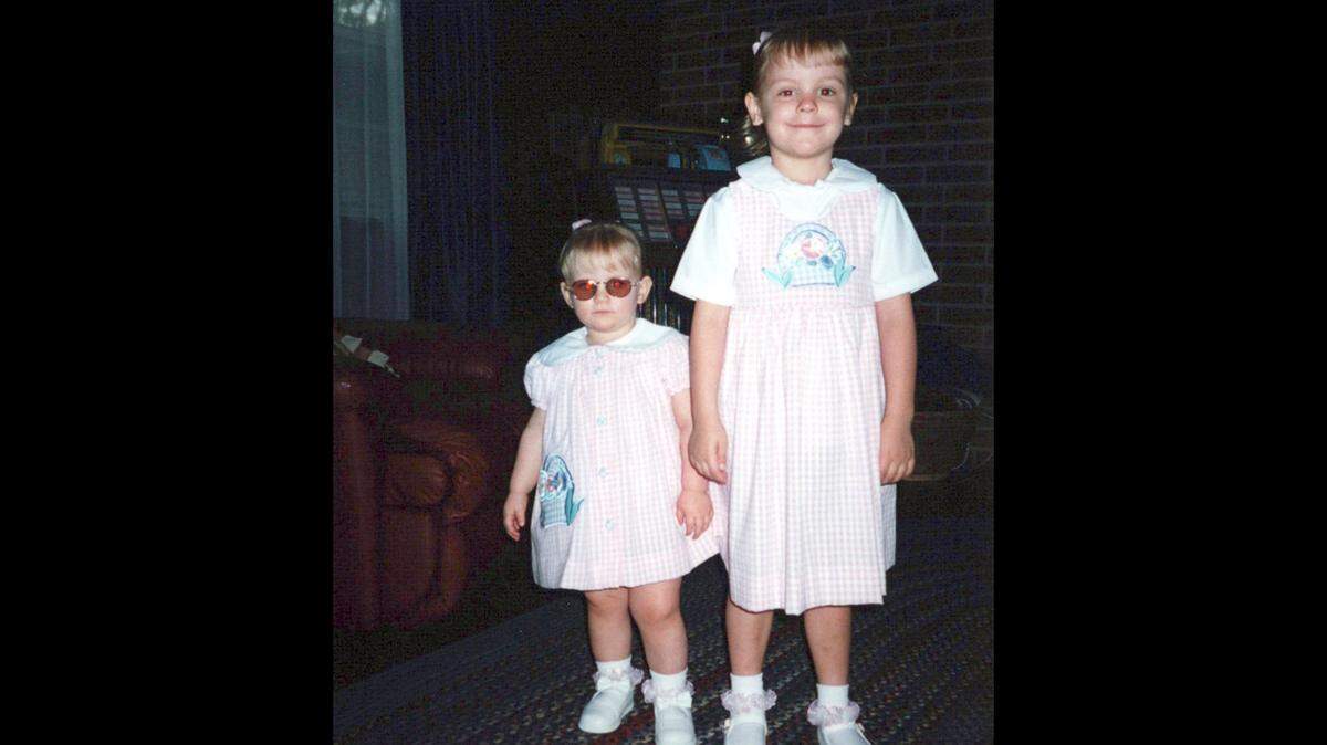 A childhood photo of Callie Marshall, left, with sister Rocky Tucker. Marshall was born with Alström syndrome, a rare genetic disease that causes, among other things, vision and hearing loss, heart and lung disease and diabetes.