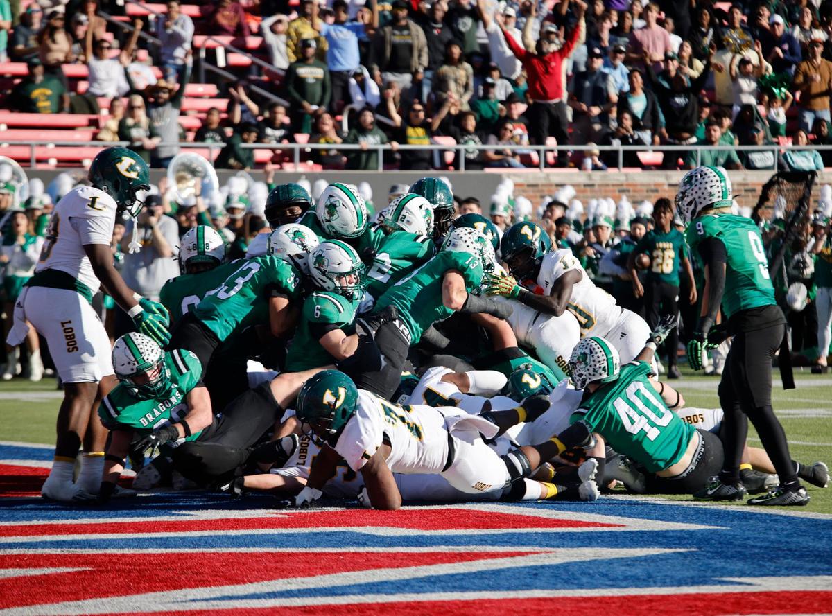Somewhere in the pile is Longview’s first touchdown against Southlake Carroll during the UIL 6A D2 Semifinals football game at Gerald J. Ford Stadium in University Park, Texas, Saturday, Dec. 14, 2024.