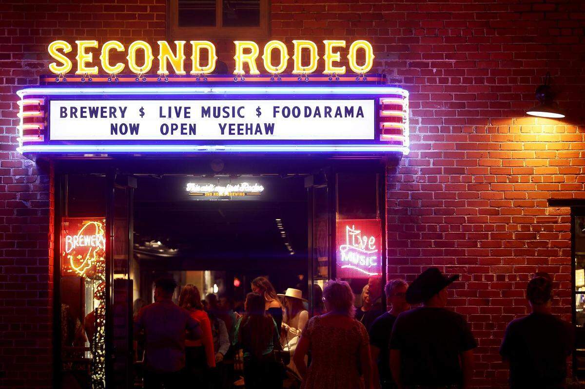 A crowd gathers to enter Second Rodeo Brewery located on Mule Alley in the Stockyards on Friday, December 10, 2021. The establishment is one of many attracting visitors to Mule Alley.