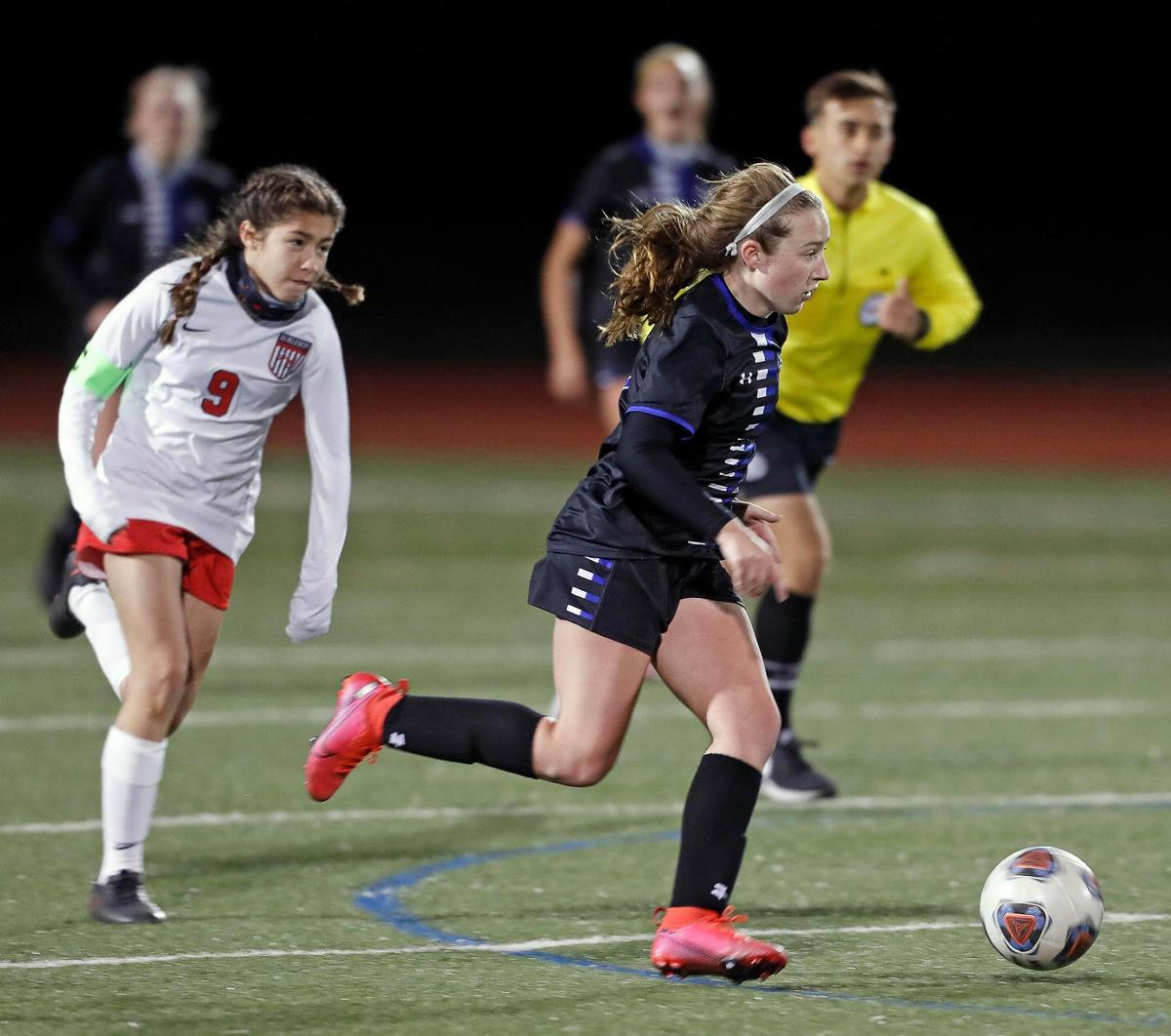 Burleson midfielder Karina Moore (9) chases Centennial Logan Stevens (17) down the pitch during a 8-5A girls soccer game at Burleson Centennial in Burleson, Texas, Friday, Feb. 05, 2021. Centennial defeated Burleson 6-0. (Special to the Star-Telegram Bob Booth)