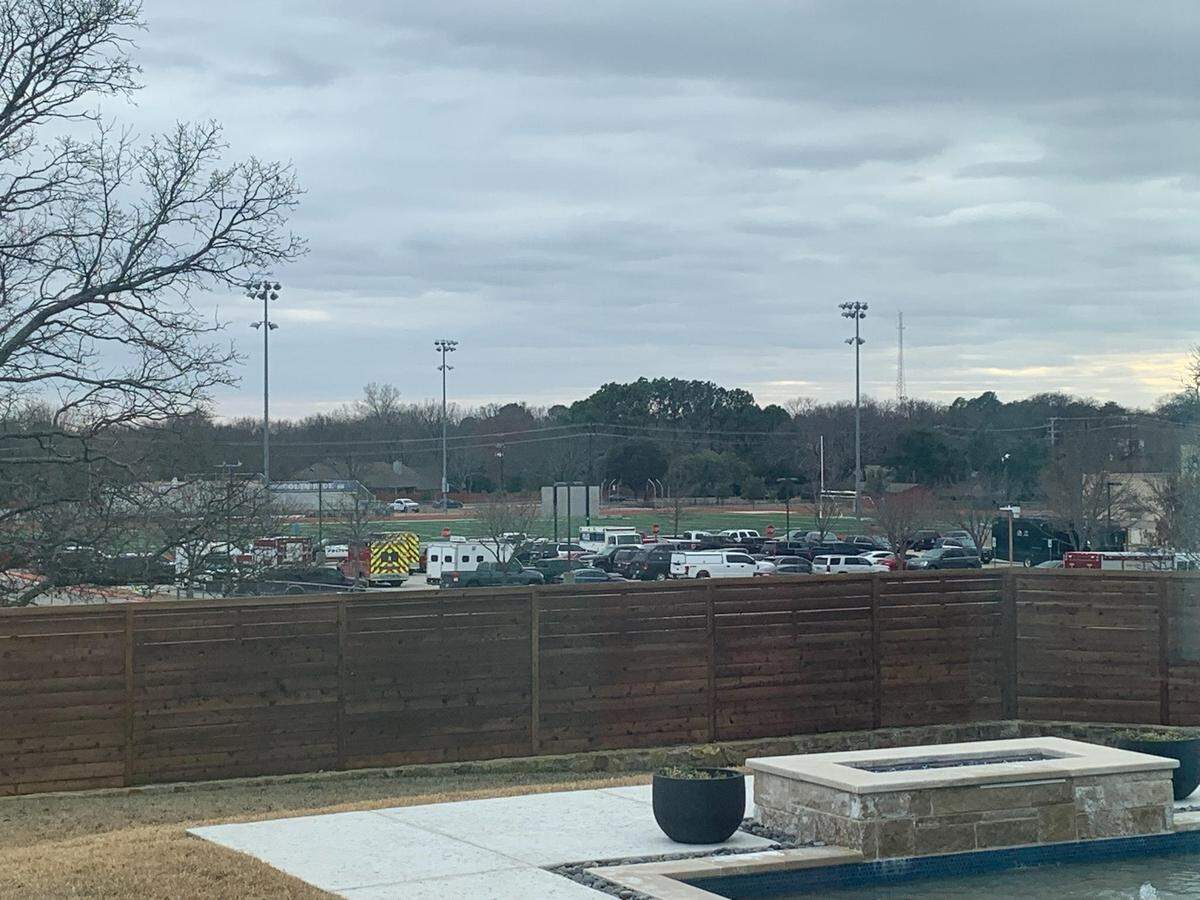 Lani Hendrix, who lives on Cooks Court just across the street from the synagogue, said she watched as cops, SWAT team members and firefighters gathered in the nearby school parking lot.