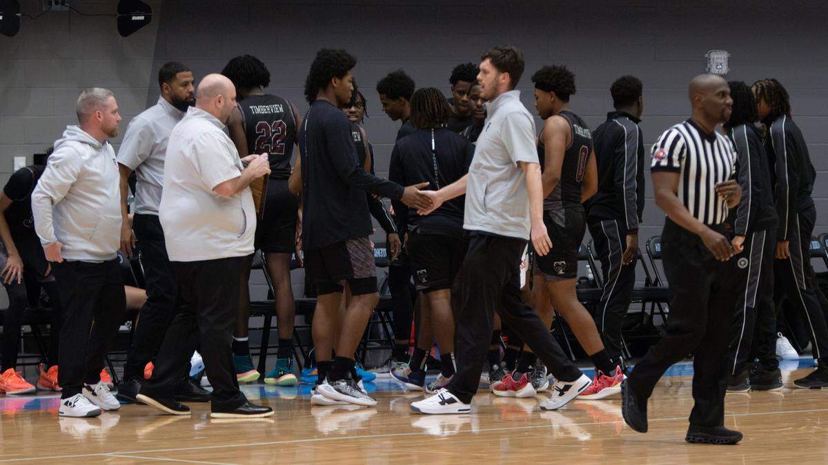 The Mansfield Timberview boys basketball team heads into a time out against Fort Worth Paschal in a Class 5A Division 1 bi-district game on Tuesday, February 18, 2025 at the Arlington ISD Athletics Center in Arlington, Texas. Timberview defeated Paschal 62-39.