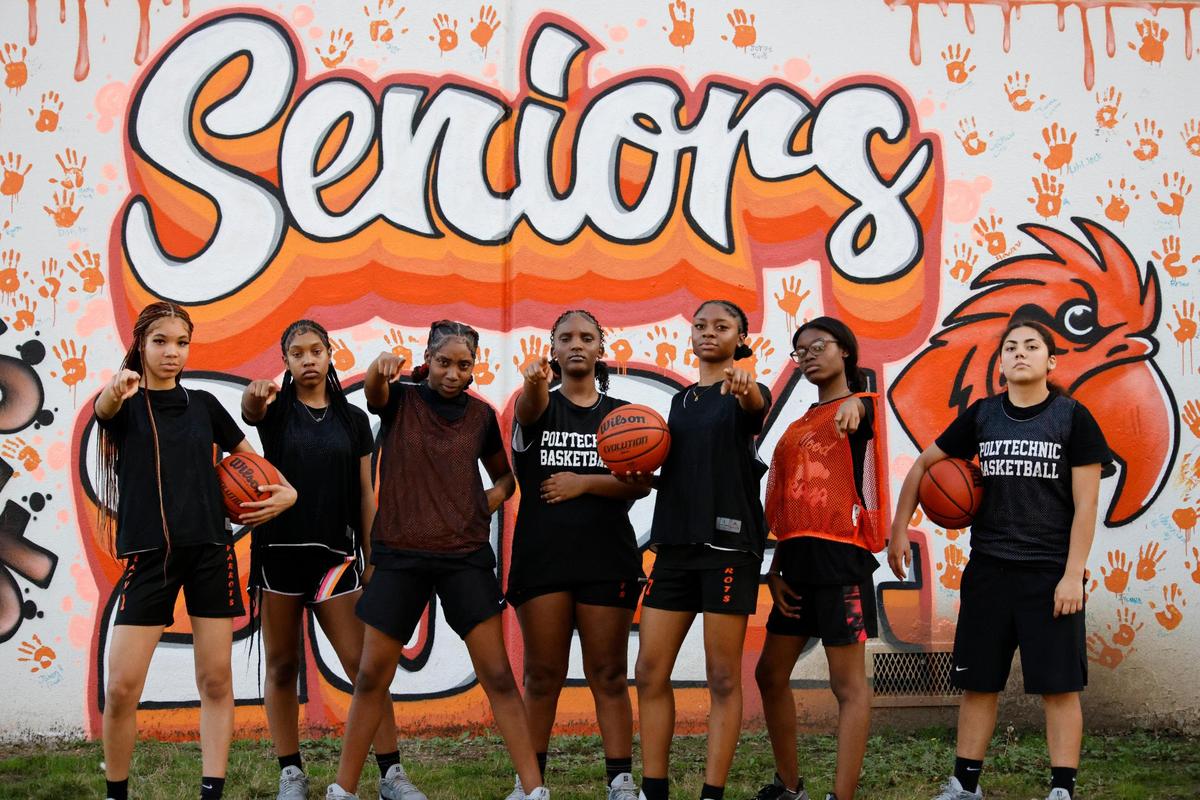 Cecilia Aguilar, Taty Fannin, Lauren Watson, Kassidy Young, Lakendra Williams, Merveille Ikibasimba and Serenity Tolbert in front of a mural painted by the Senior 2024 class after practice at Polytechnic High School outside gym in Fort Worth, Texas, Thursday, Feb. 06, 2025.