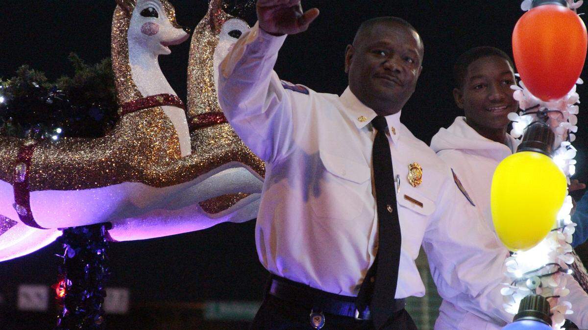 Grand Marshal and FWFD Chief Rudy Jackson waves to the crowd at the 2017 XTO Energy Parade of Lights in downtown Fort Worth, Nov. 19.