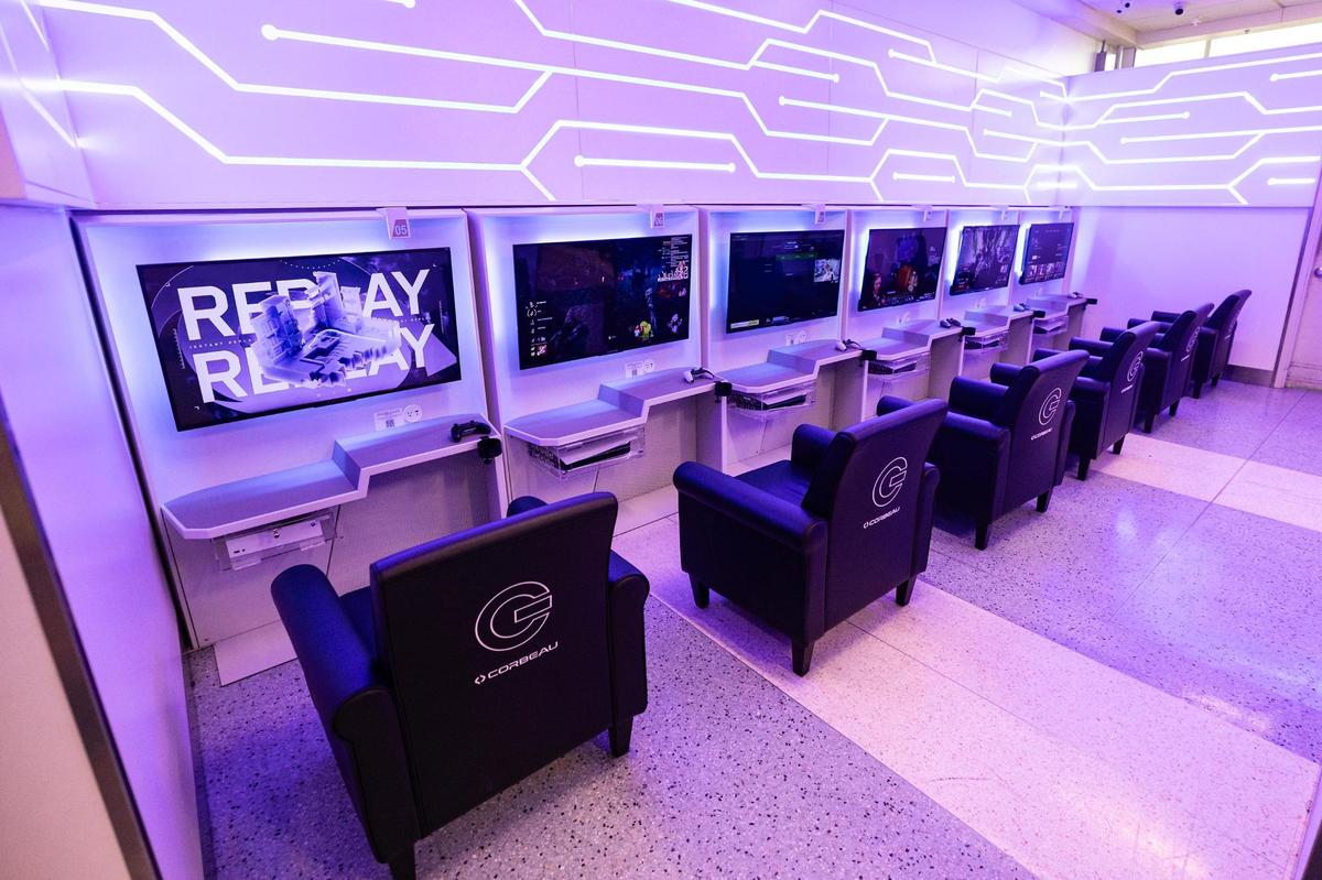Gameway video game lounge is lined with multiple gaming stations equipped with PlayStation or Xbox consoles to go along with cushioned chairs.