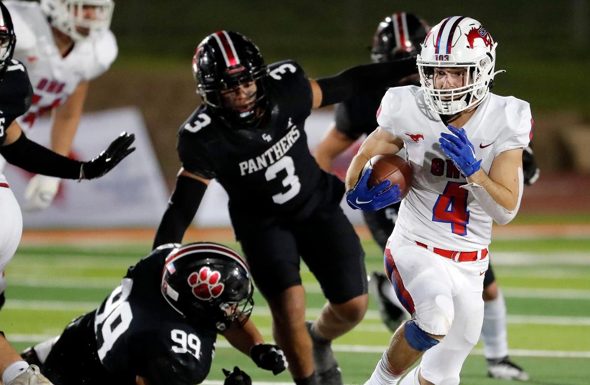 Grapevine running back Parker Polk (4) and the Mustangs enter Week 10 with a 5-0 district record.