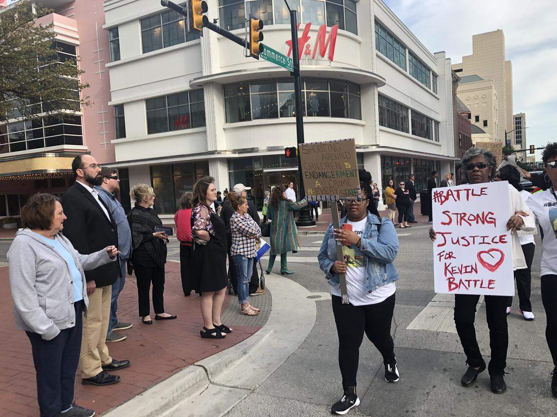 Protesters marched through downtown Fort Worth Friday, calling for charges to be filed against a man who shot and killed Kevin Battle on March 25. The man says he shot Battle in self-defense.