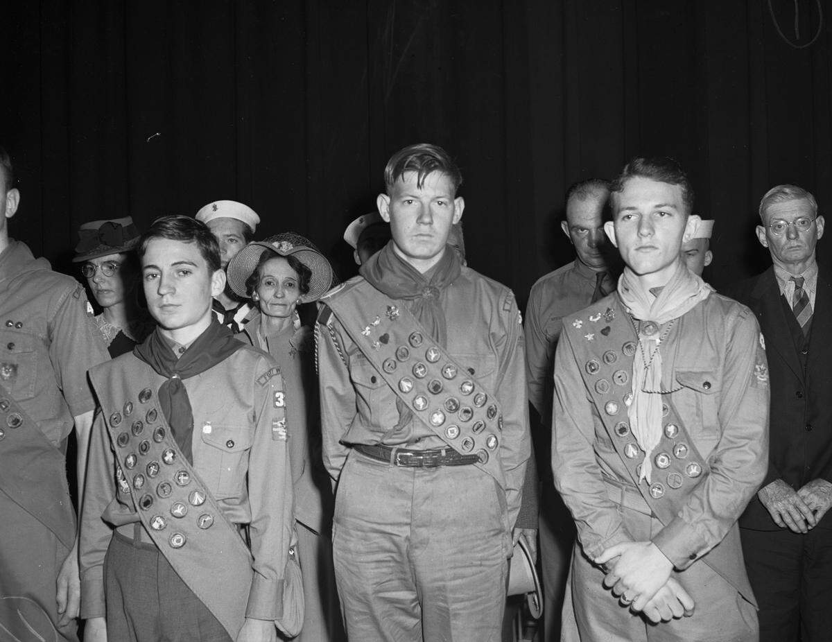 Feb. 14, 1942: At the annual meeting of the Fort Worth Council, Boy Scouts of America, at Will Rogers Auditorium, Jack Jackson, Raymond Worthington and James Irvine (left to right) were presented with Silver Beaver awards. They are wearing their scout uniforms and sashes that display all the badges they have earned.