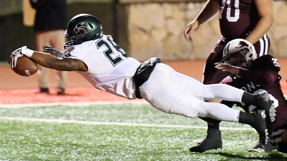 Kennedale’s DJ Kirven, left dives into the endzone in front of Brownwood’s Cooper Swanzy to give the Wildcats a 21-0 lead during the first quarter of Thursday’s  November 15, 2018 high school play-off football game in Glenn Rose, Texas. Special/Bob Haynes
