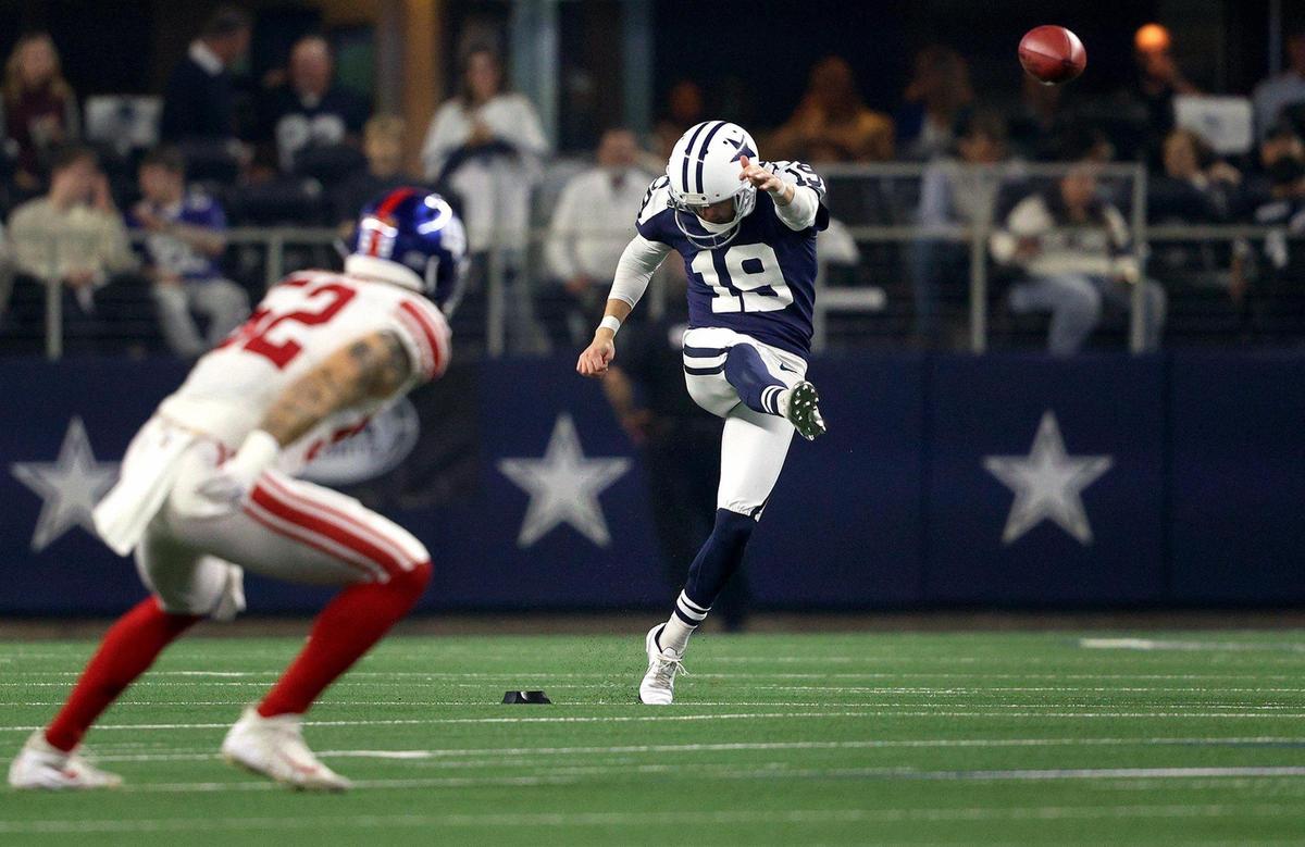 Dallas Cowboys kicker Brett Maher kicks the ball during the first half against the New York Giants on Thursday, November 24, 2022, at AT&T Stadium in Arlington.