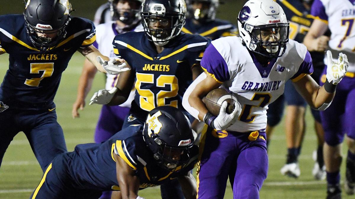 Grranbury’s Darrius Evans, right breaks the tackle of Arlington Heights’s Jamarius Battley as he rushes in for the touchdown to take a 7-0 lead in the first quarter of their Division 1 District 3-5A football game Thursday, November19, 2020 at Farrington Field in Fort Worth, Texas. Special/Bob Haynes