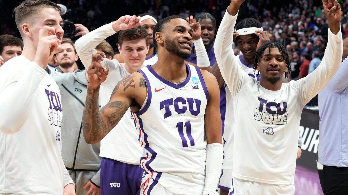 TCU guard Rondel Walker, center, and teammates celebrate a win over Arizona State in a first-round college basketball game in the men’s NCAA Tournament on Friday, March 17, 2023, in Denver. (AP Photo/David Zalubowski)
