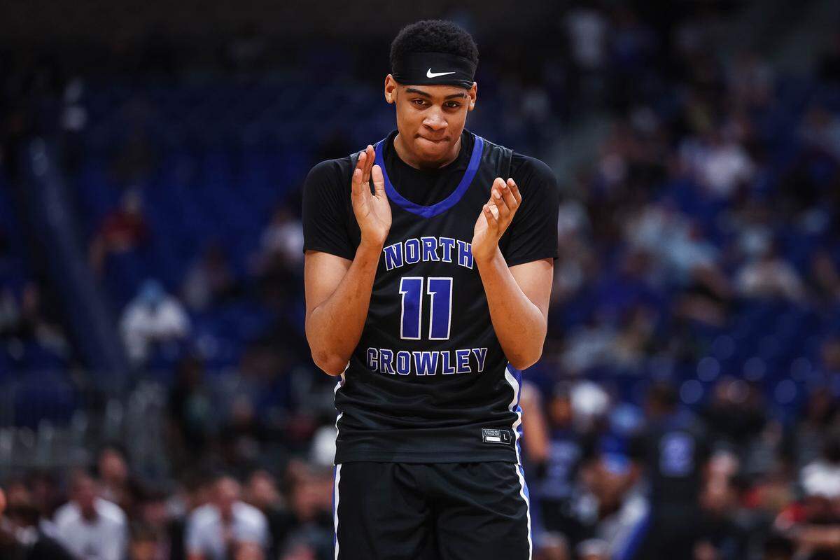 North Crowley forward Trey Hall claps his hands in celebration as the clock winds down in the Class 6A Division I state championship game against San Antonio Brennan on Saturday at the Alamodome in San Antonio.