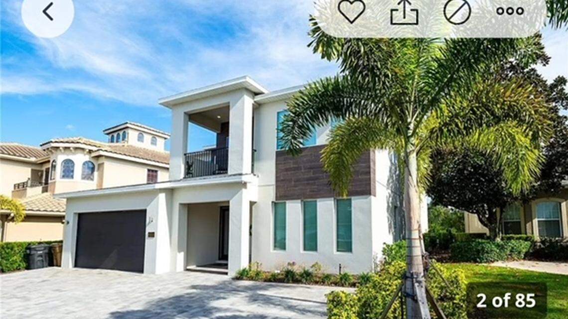 The exterior of an estate for sale in Kissimmee, Florida, that features a military helicopter that was converted to a bedroom.