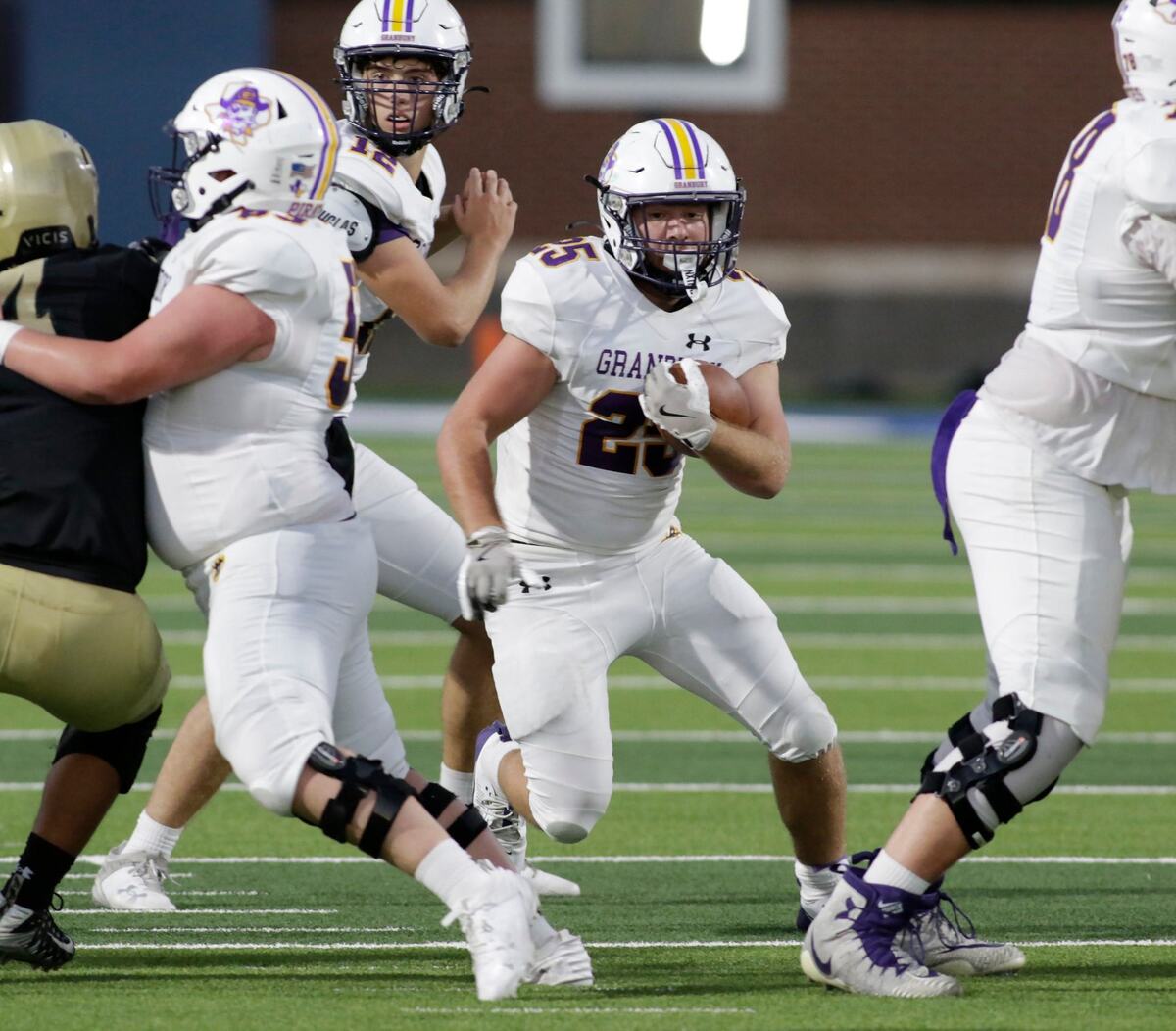 Grandbury’s Tony Debello carries the ball during Grandury’s game Thursday night at the Birdville Athletic Center. JOHN ROWLAND