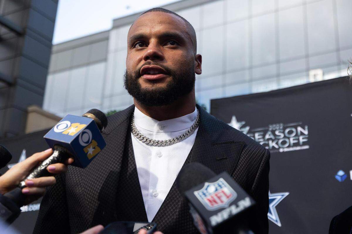 Dallas Cowboys Dak Prescott talks to reporters on the blue carpet for the season kickoff event Thursday, Aug. 25, 2022, at Ford Center in Frisco.