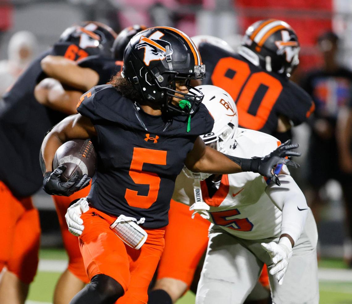 Haltom running back Vudrico Roberson (5) carries around the right side of the line during a District 8-6A football game at Birdville Fine Arts/Activity Complex in North Richland Hills, Texas, Friday, Oct. 25, 2024.