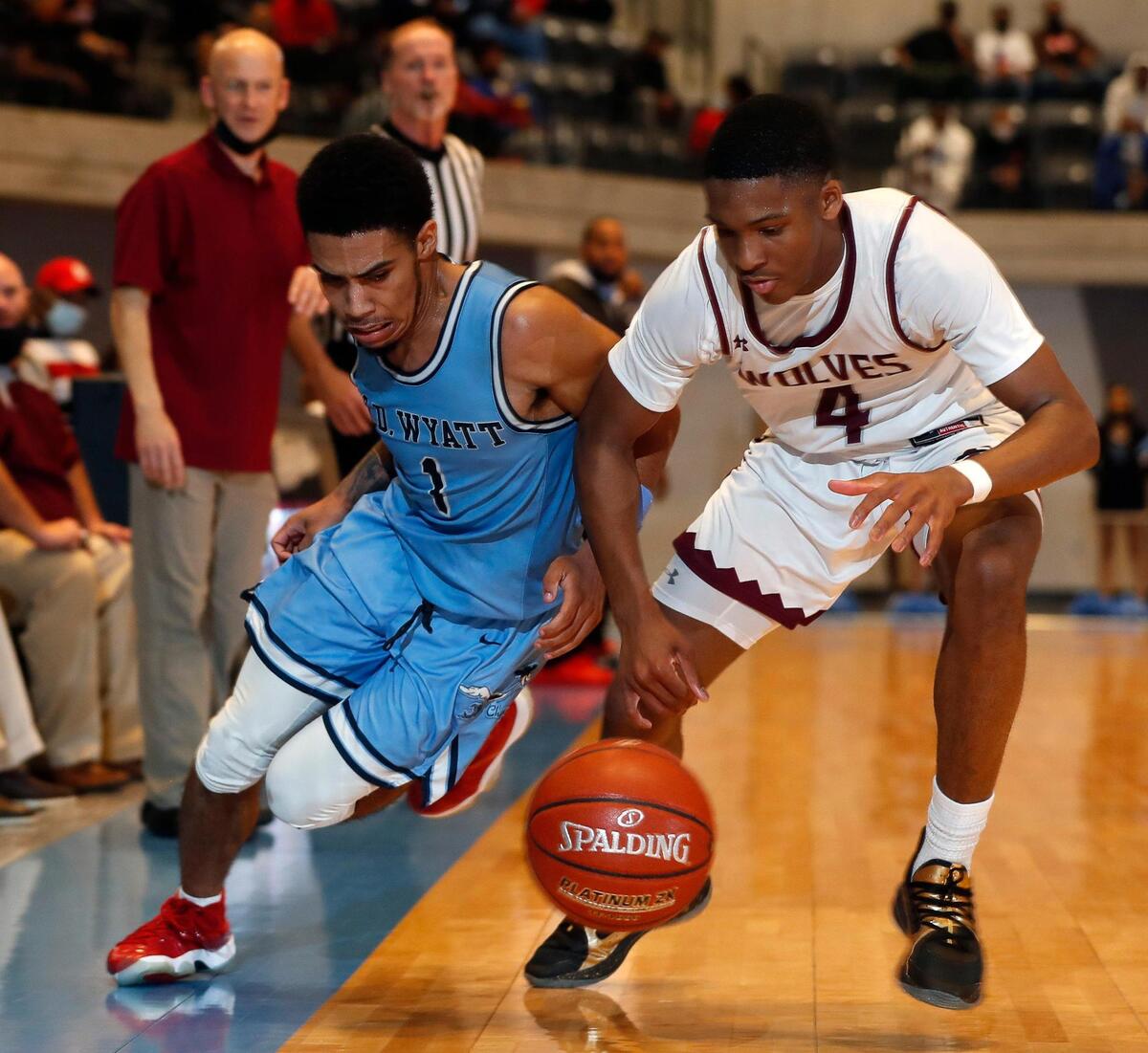 Wyatt guard Jacobi Lewis (1) and Timberview guard Donovan O’Day (4) go for a loose ball during the second half of a Division 5A Region 1 quarterfinal basketball game at Arlington ISD Athletics Complex in Arlington, Texas, Saturday, Feb. 27, 2021. Timberview defeated O.D. Wyatt 57-55. (Special to the Star-Telegram Bob Booth)