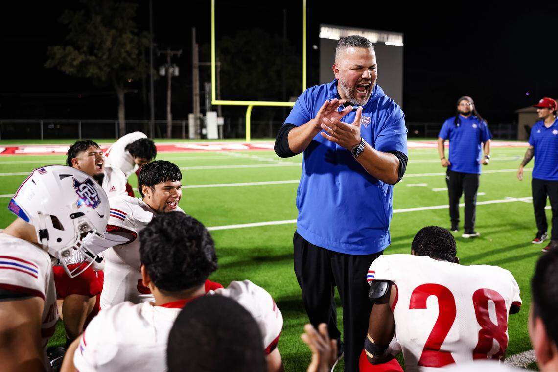 Fort Worth Carter-Riverside head coach David Lara talks to his players after they clinched a playoff berth with a win over Fort Worth Western Hills on Nov. 7 at Scarborough-Handley Field.