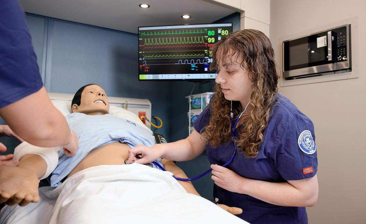 Meredith Doremus, an adviser for student services, participates in a simulated medical emergency at the University of Texas at Arlington’s “smart” hospital. 