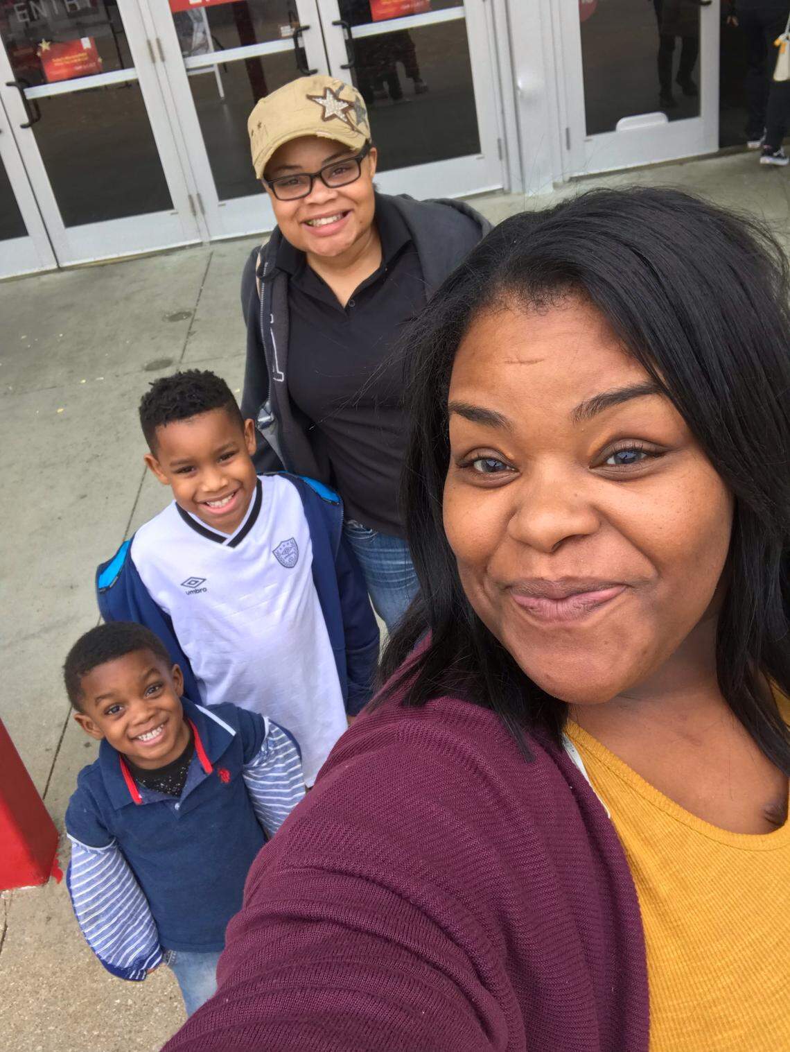 Atatiana Jefferson (middle right), her nephew Zion (middle left) and other family members pose for a photo. Zion was in the room early Saturday morning when Fort Worth police officer Aaron Dean shot and killed Jefferson through a window.
