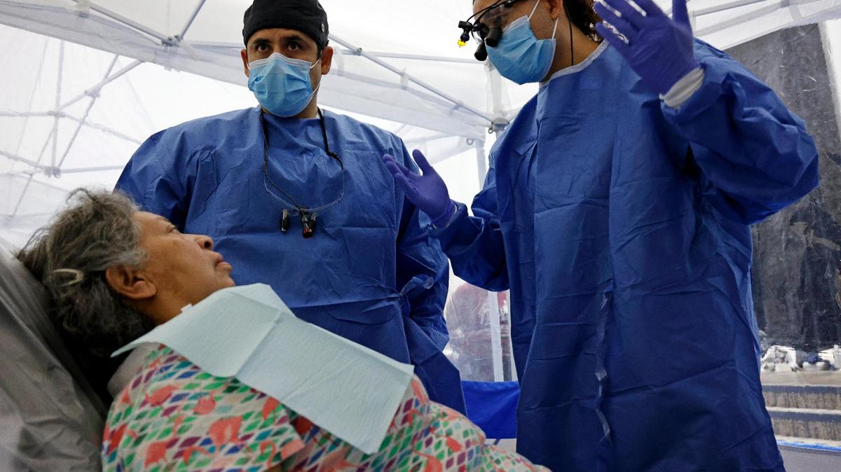 Fourth year dental students Carlos Andrade and Miguel Rangel talk to Gaby Gonzalez about her dental problems at the Remote Area Medical Clinic at the Southwestern Baptist Theological Seminary in Fort Worth, Texas, Saturday, Nov. 04, 2023. The clinic is available to anyone who wished to use its services. (Special to the Star-Telegram)