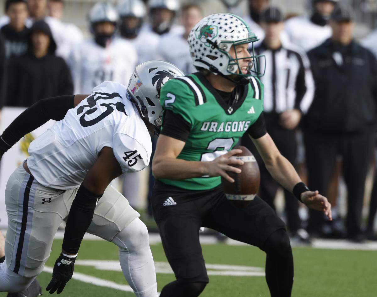 Southlake Carroll quarterback Angelo Renda (2) looks downfield for a receiver during the first half of a UIL Class 6A Division II quarterfinal on Saturday, Dec. 6, 2025 at Crowley ISD Multi-Purpose Stadium in Fort Worth, Texas.