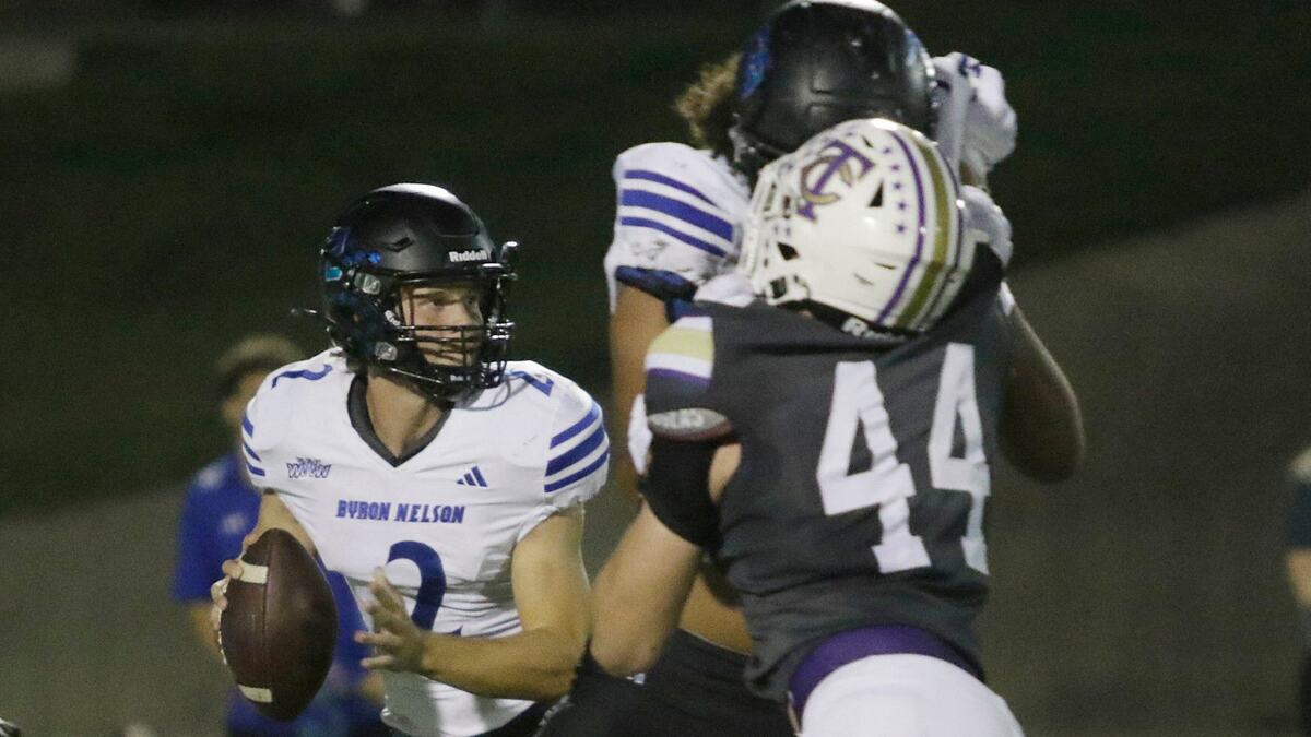Trophy Club Byron Nelson quarterback Grant Bizjack looks for a receiver during a UIL football game against Keller Timber Creek at Keller ISD Stadium on Thursday, October 3, 2024.