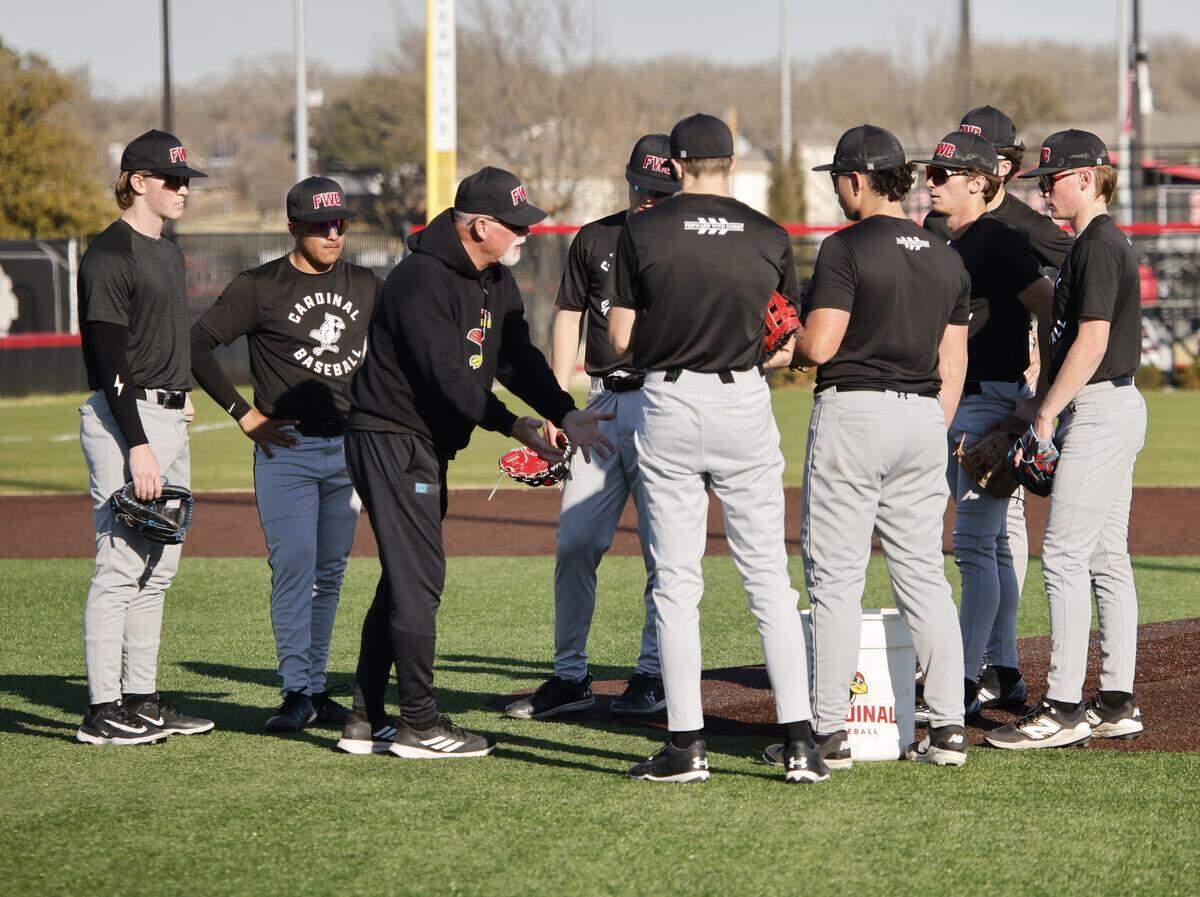 Fort Worth Christian head baseball coach Rusty Greer explains some strategy to players during baseball practice at Fort Worth Christian School in North Richland Hills, Texas, Monday, Feb. 23, 2026.