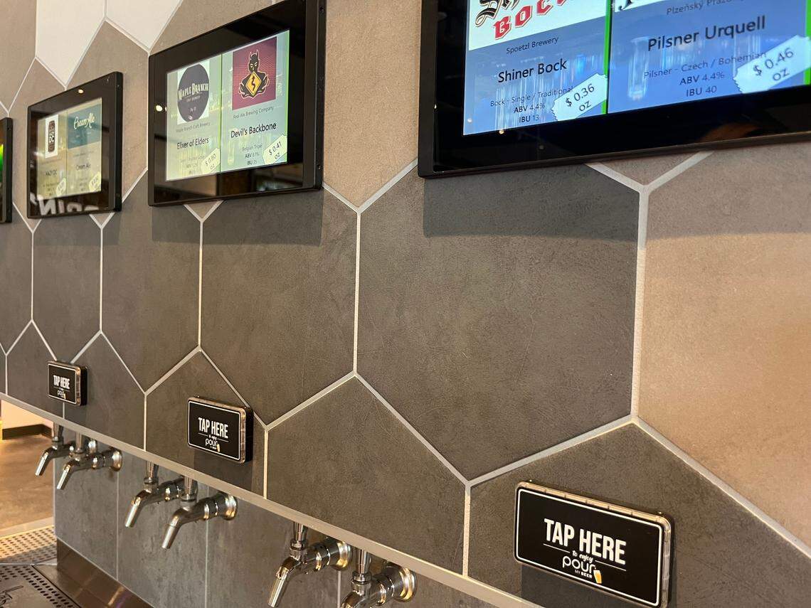 The Tap Here buttons are activated by wristbands that also keep track of your tab. Beer is payed for by the ounce so nothing goes wasted.