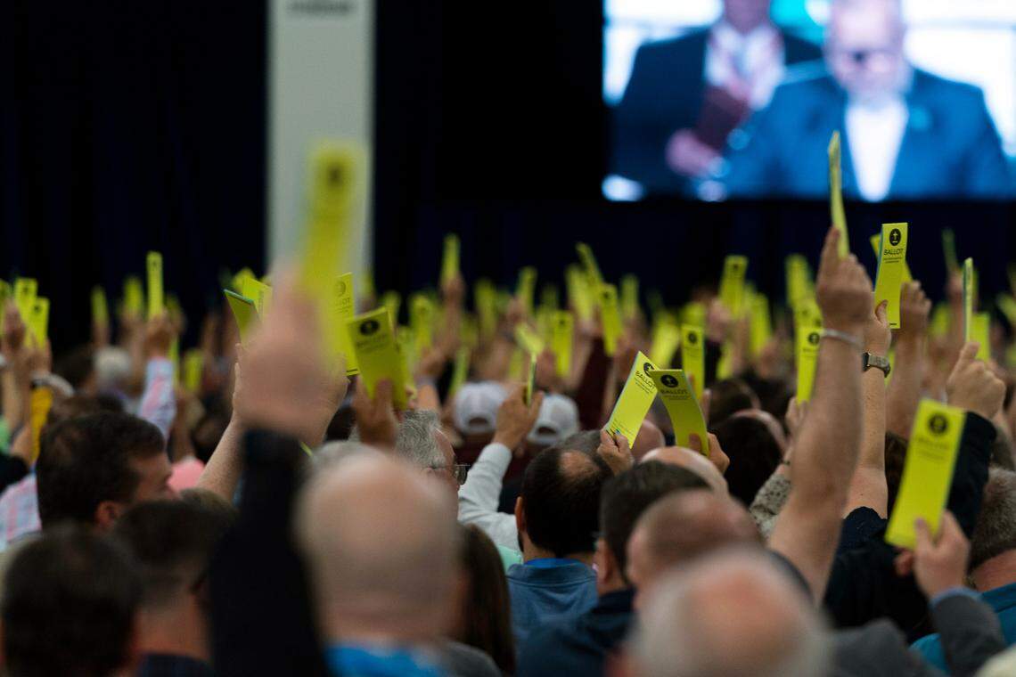 Attendees hold up their ballots during a session at the Southern Baptist Convention’s annual meeting in Anaheim, California, on Tuesday, June 14, 2022.