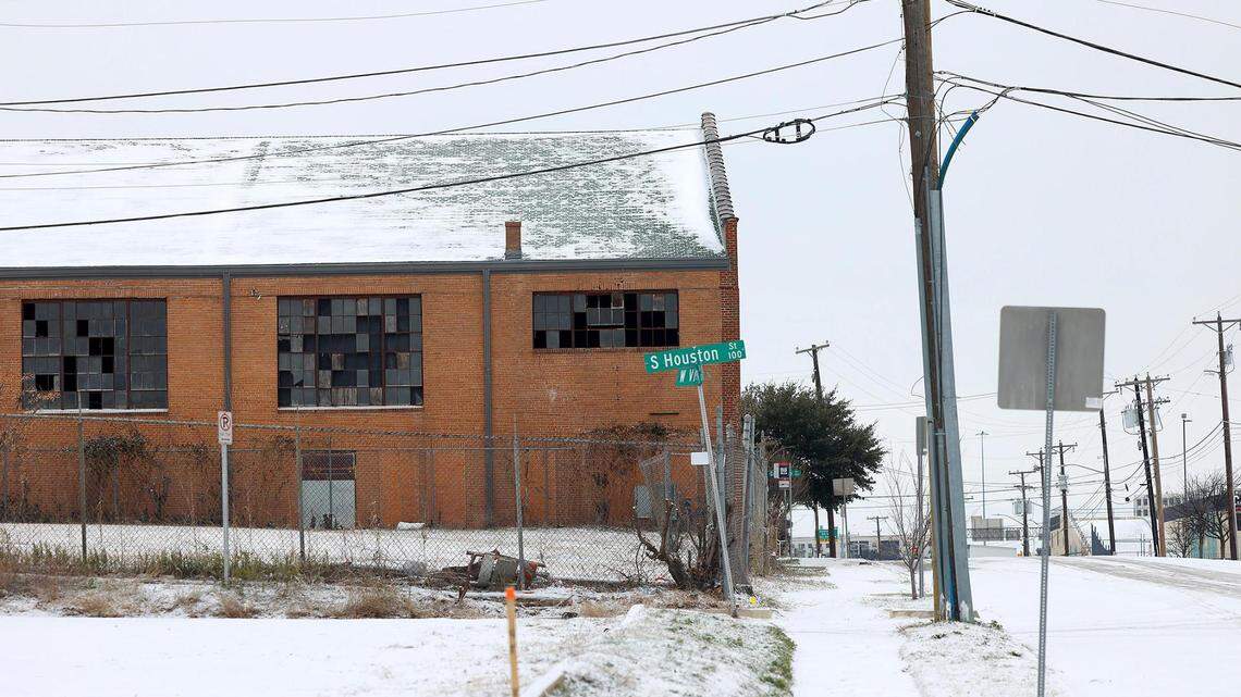 A thin layer of snow coats building and roads near downtown Fort Worth on Monday, January 15, 2024.