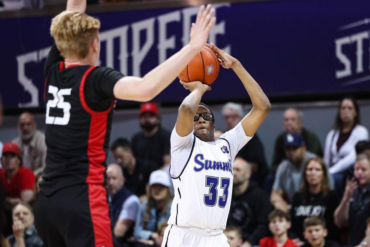Mansfield Summit guard Javon Ross (33) attempts a 3-pointer over a leaping Lovejoy defender during a Class 5A Division II state semifinal at Moody Coliseum in Dallas, March 10, 2026.