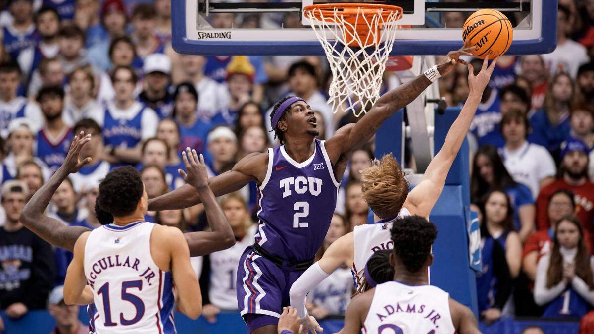 TCU forward Emanuel Miller (2) blocks a shot by Kansas guard Gradey Dick (4) during the second half on Saturday, at Allen Fieldhouse in Lawrence, Kan.